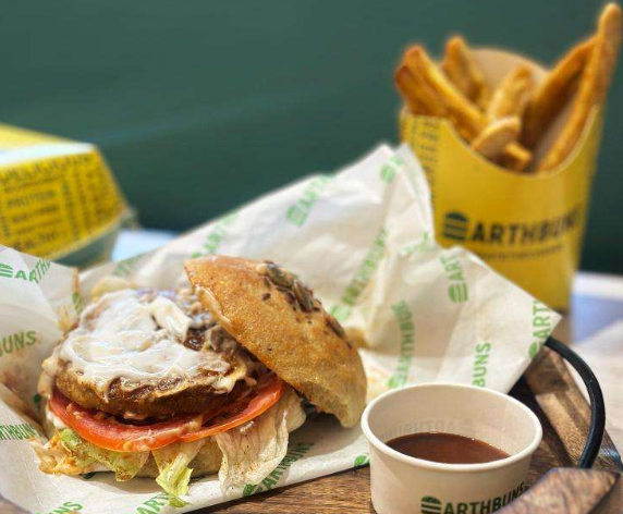 Earth Buns burger meal with fries and sauce